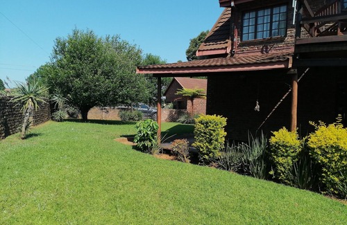 Graskop House | Enjoy the beauty of nature, see the mountain view when standing outside.