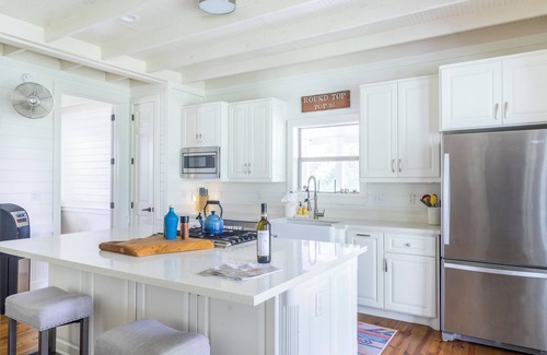 Round Top House | Enjoy the best of fall fun in comfort and style! Relax by the pool, play a round of pickleball, or unwind around the cozy fire pit.