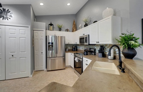 Fort Myers Condo | Enjoy the Colonial Country Club Lifestyle! Beautiful 2nd Floor Condo, Bikes & Tranquil Water Views!