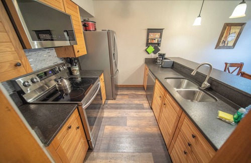 Mountain House Condo | Enjoy the pool & hot tub with an amazing view