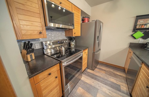 Mountain House Condo | Enjoy the pool & hot tub with an amazing view