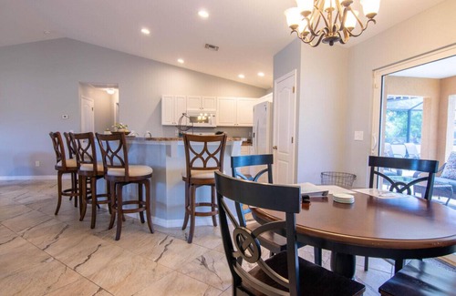 Diplomat House | Enjoy the Salt Life with this Heated Saltwater Pool and outdoor lanai.