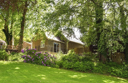 Kilcreggan Cottage | Enjoy the stunning loch views from the lounge or outdoor seating area.
