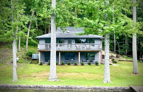 Grant House | Escape to our beautifully updated lakeside retreat, where every detail is designed for comfort and relaxation. From the moment you step inside this 3 bed/2bath house, you'll be captivated by sweeping, unobstructed views of the lake through expansive