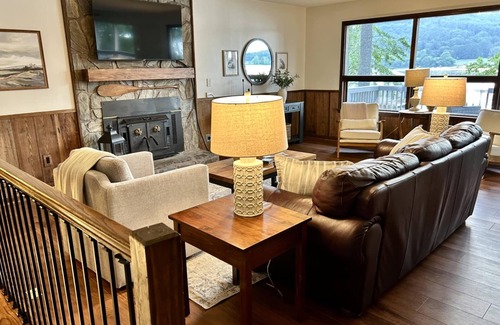 Grant House | Escape to our beautifully updated lakeside retreat, where every detail is designed for comfort and relaxation. From the moment you step inside this 3 bed/2bath house, you'll be captivated by sweeping, unobstructed views of the lake through expansive