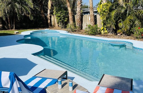 South Patrick Shores House | Escape to Paradise! Stunning Poolside Haven Just Moments from the Shore.