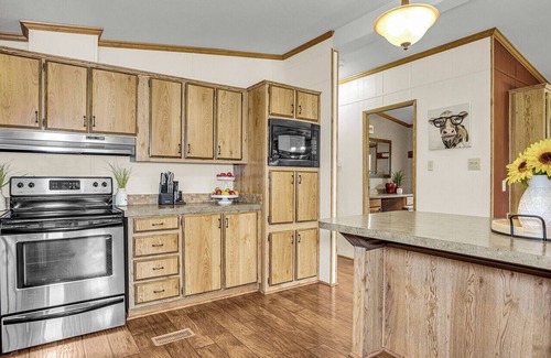 Munds Park Cabin | Escape to Pinewood Canyon Cabin — a cozy 2BR/2BA retreat nestled in the pines of Munds Park. With Inviting interiors, a relaxing deck, and direct forest access, it’s the perfect basecamp for year-round adventure and mountain serenity.