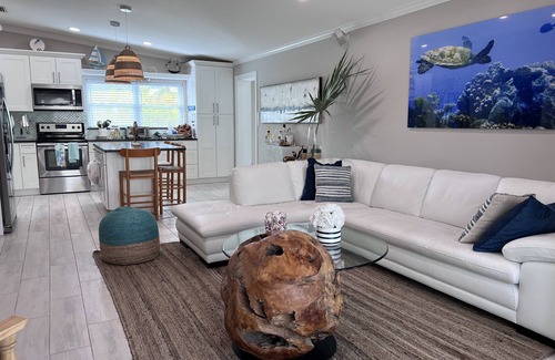 Big Pine Key House | Escape to the Florida Keys to this tropical canal-front home with boat dockage.