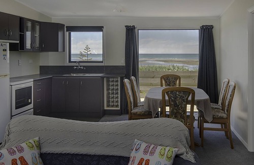 Tasman Cabin | Escape to the tranquil Helme Holiday Bottom Bach, kiwi charm on beautiful Kina Peninsula