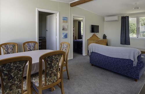 Tasman Cabin | Escape to the tranquil Helme Holiday Bottom Bach, kiwi charm on beautiful Kina Peninsula