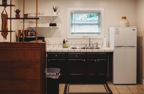Phoenix House | Escape to this artsy 2-bedroom MCM Guesthouse in charming Phoenix, OR. Unwind in the luxurious spa soaking tub after exploring Southern Oregon. Features high-end design for a stylish, quiet retreat.