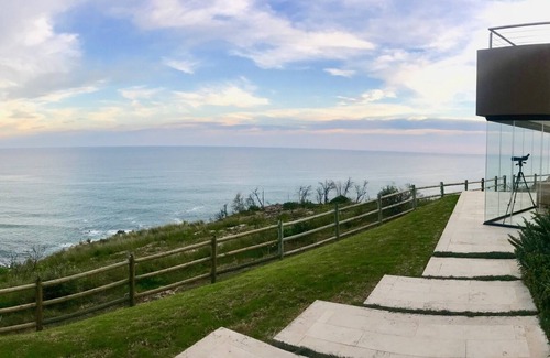 Knysna Villa | Exclusive, Luxurious Villa perched above cliffs with indoor pool & ocean views.