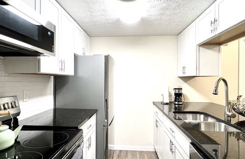 Vandalia Condo | Executive Condo: King primary en-suite! A part of the Uptown Collective Suites