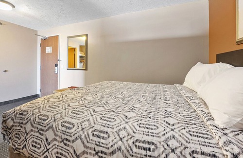 Put-in-Bay House | Experience Luxury and Comfort in Our Spacious Suite with Room Divider 318