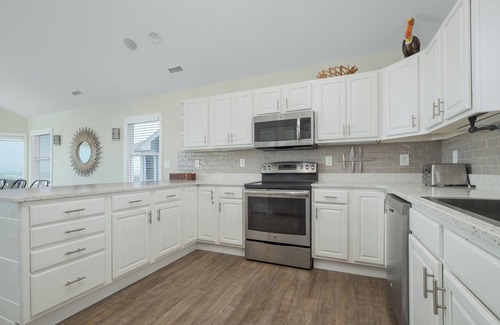 Ocean Sands House | Experience luxury at 1861 - Into the Mystic, a spacious 6-bedroom oceanfront home in Corolla, NC.