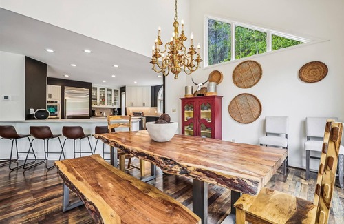 Dunkin Hill House | Experience luxury at Stormbunker Paradise, a spacious 4-bedroom house with stunning wooded views!