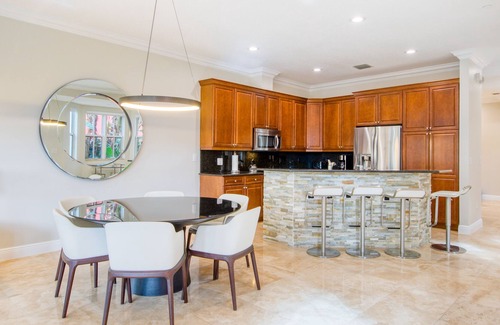 Coral Ridge House | Exquisite home with jetted bathtub, balconies, enclosed yard & elevator