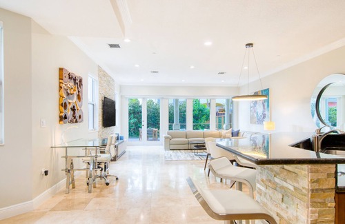 Coral Ridge House | Exquisite home with jetted bathtub, balconies, enclosed yard & elevator
