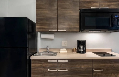 Westgate Hotel | Extended Stay Comfort in Room with Full Kitchen Near Zing Zumm Children's Museum