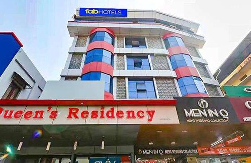 Shenoys Hotel | Fabhotel Central Queens Residency