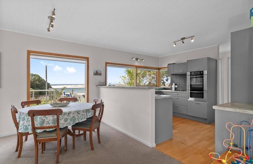 Mangawhai Heads House | Fairport House - Sunny holiday home with large decks, lovely views and a short stroll to the estuary