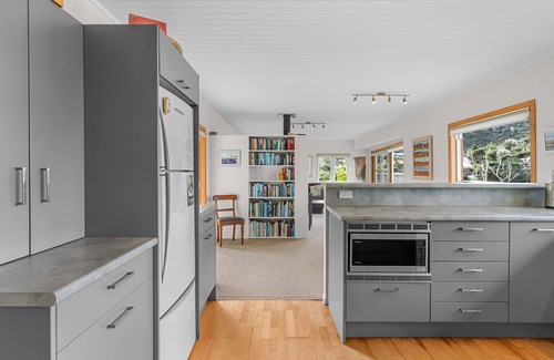 Mangawhai Heads House | Fairport House - Sunny holiday home with large decks, lovely views and a short stroll to the estuary