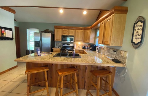 Eucha Cabin | Fall lake days! Popular Grand Lake Dripping Springs cliffside lake view cabin