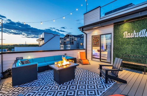 Katie Hill Neighborhood House | Fall rooftop decks, hot tub, speakeasy lounge near Broadway