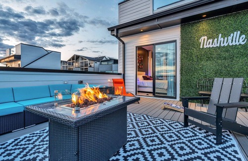 Katie Hill Neighborhood House | Fall rooftop decks, hot tub, speakeasy lounge near Broadway