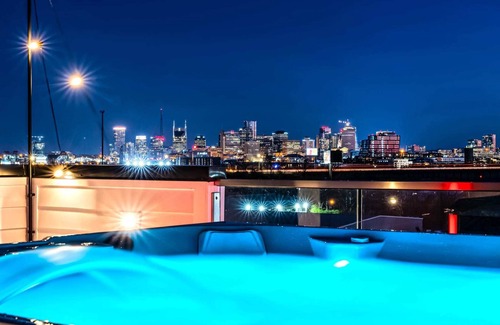 Katie Hill Neighborhood House | Fall rooftop decks, hot tub, speakeasy lounge near Broadway