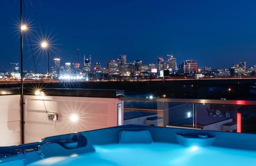 Katie Hill Neighborhood House | Fall rooftop decks, hot tub, speakeasy lounge near Broadway