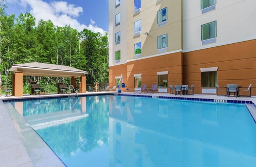 Florida Central Atlantic Coast Apartment | Family Fun in Orlando: Suite Accommodations with Pool & Shuttle!