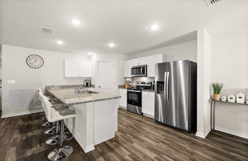 Palm Coast Apartment | Family Pool Retreat Sleeps 10 Near Beach BBQ