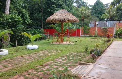 Sauce House | Family vacation home with a view of the forest and access to a small river.