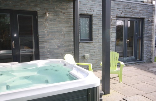 Talland House | Fantastic pet friendly property with large roof area, Charcoal BBQ, ideal for sunbathing and alfresc