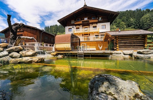 Bramberg am Wildkogel House | Farmhouse in Bramberg with Natural Pond