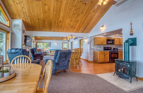 Rangeley House | Fielding Lakehouse - Spacious home with nice grass area leading to Rangeley Lake