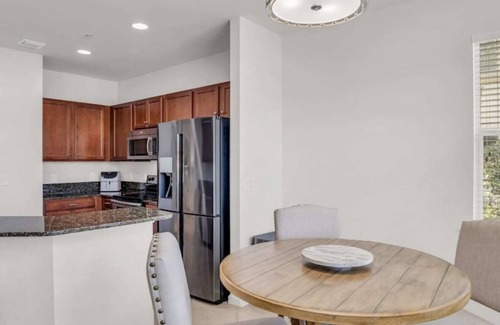 Bonita Springs Condo | First Floor Coach Home with Breathtaking Sunsets Overlooking Lake in Hawthorne