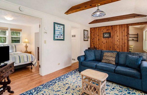 Frankfort Cottage | Flower-lined cottage with beautiful lake views, firepit access, and yard games