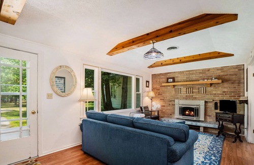 Frankfort Cottage | Flower-lined cottage with beautiful lake views, firepit access, and yard games