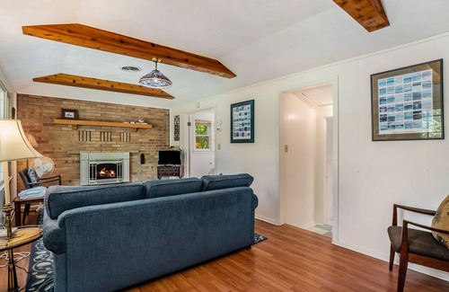 Frankfort Cottage | Flower-lined cottage with beautiful lake views, firepit access, and yard games