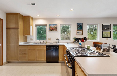 Manzanita House | Forest-view home w/fireplace, deck - Walk to the Beach & Golf Course