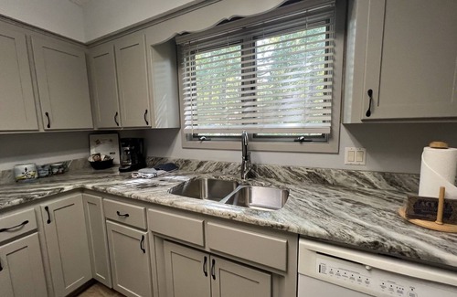 Mount Ida Condo | Forest view, log-sided two bedroom, two bath condo on Lake Ouachita. by RedAwning
