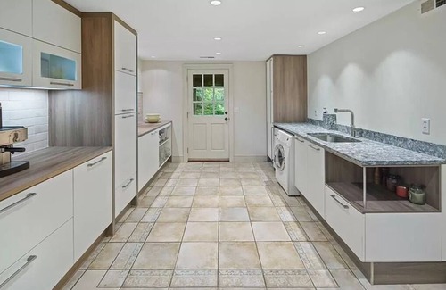 New Canaan House | Fountain Courtyard and Fireplace Kitchen