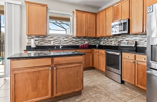 Trafalgar Village House | Freshly updated resort home with private pool, grill, soaking tubs, & smart TVs
