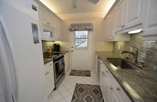 Moorings Condo | Front unit overlooking Moorings bay - 7 min walk to the Beach. 2 boat slips