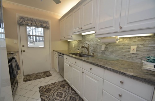 Moorings Condo | Front unit overlooking Moorings bay - 7 min walk to the Beach. 2 boat slips