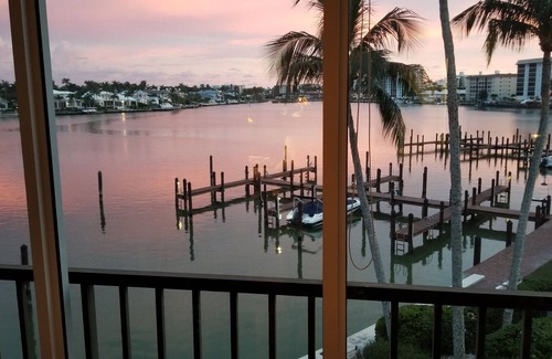 Moorings Condo | Front unit overlooking Moorings bay - 7 min walk to the Beach. 2 boat slips