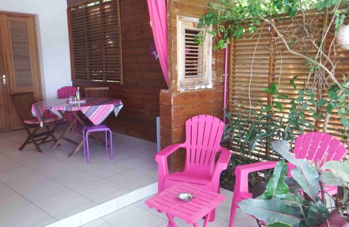 Deshaies Apartment | Fuchsia apartment in a postcard setting overlooking the Caribbean Sea
