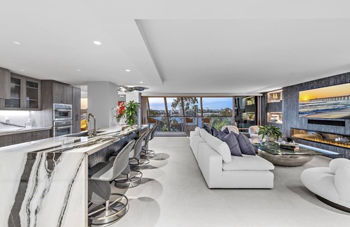 Balboa Peninsula Condo | Fully Furnished Executive Condo-Ocean Views, steps to Lido Village and the beach